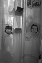 Art installation of shower curtains with the childhood photographs of the doctors who attended the conference.